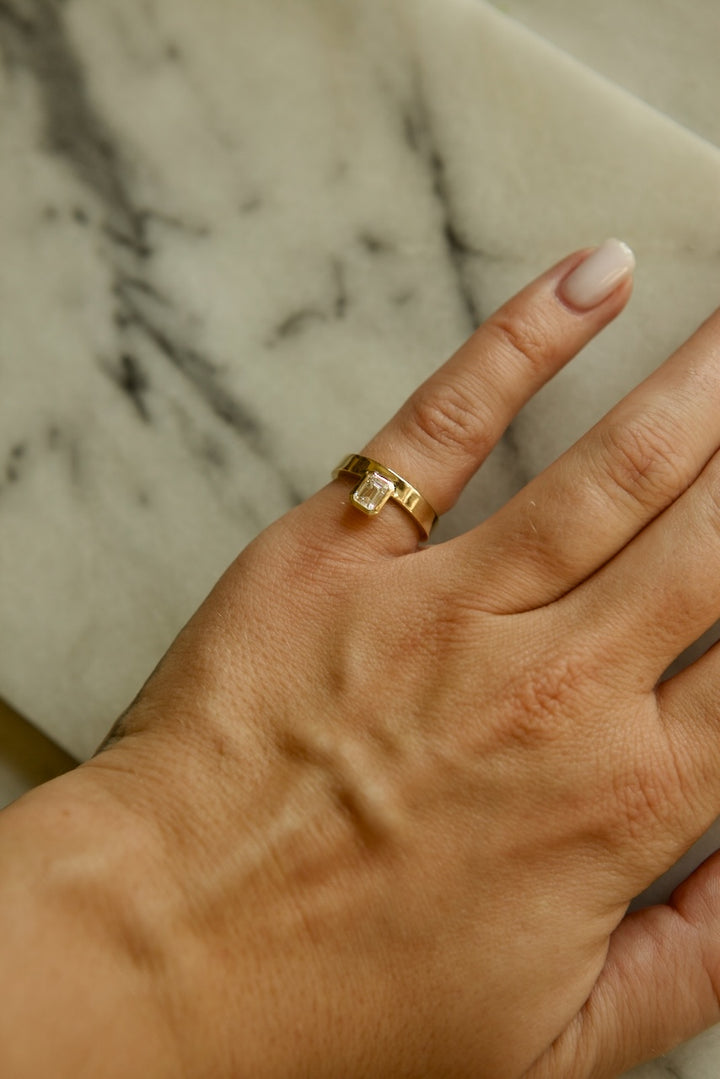 PINKY FINGER RING WITH EMERALD CUT STONE