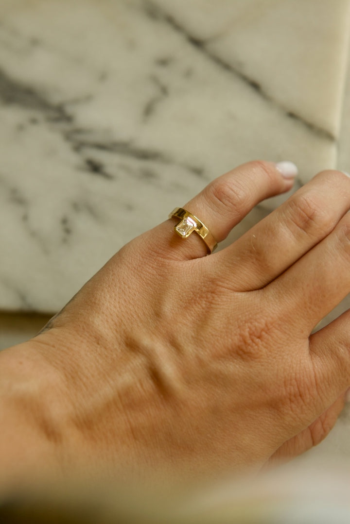 PINKY FINGER RING WITH EMERALD CUT STONE