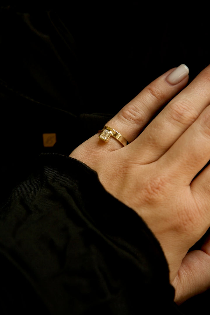 PINKY FINGER RING WITH EMERALD CUT STONE