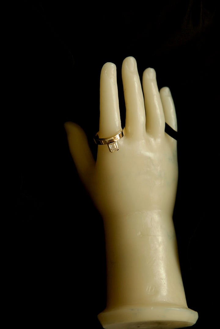 PINKY FINGER RING WITH EMERALD CUT STONE
