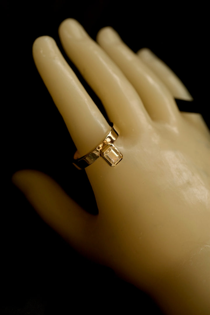PINKY FINGER RING WITH EMERALD CUT STONE