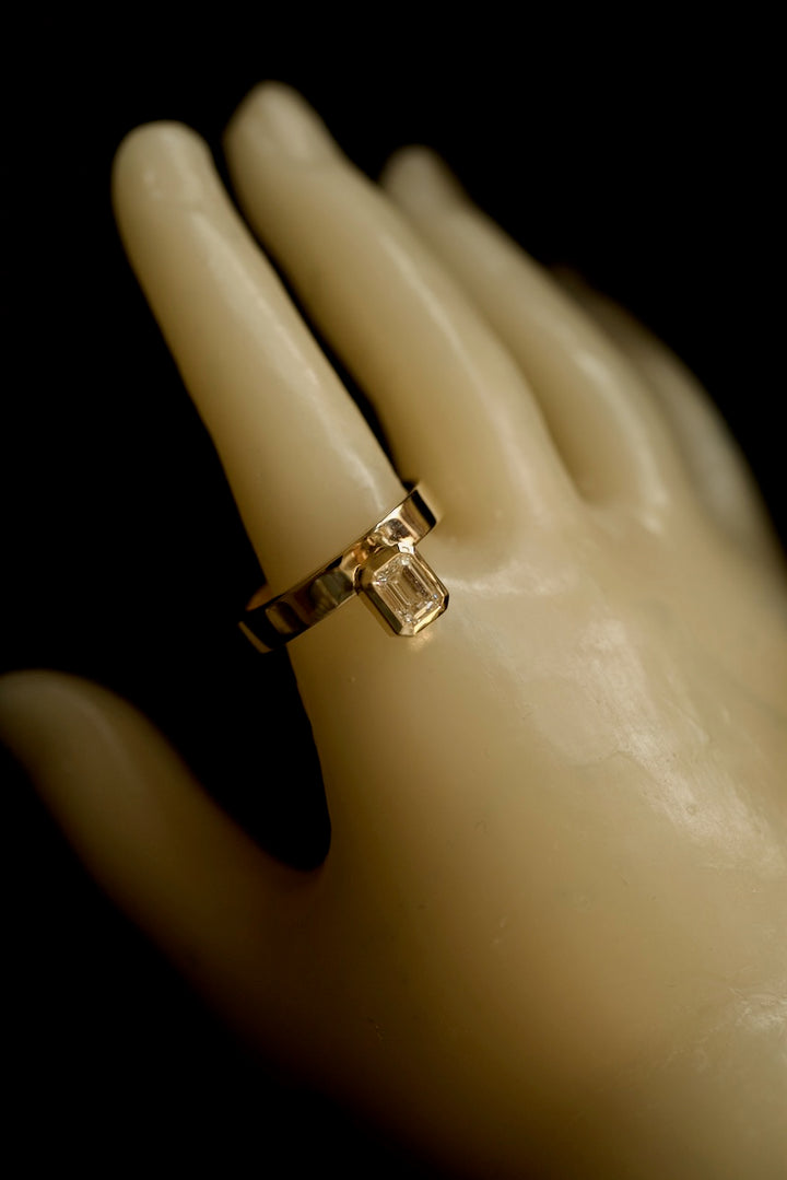 PINKY FINGER RING WITH EMERALD CUT STONE