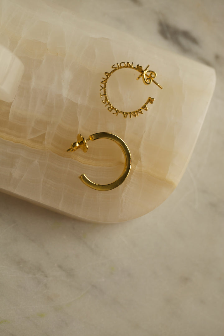 CHAPTER 1 TEXT HOOP EARRINGS - IN SILVER