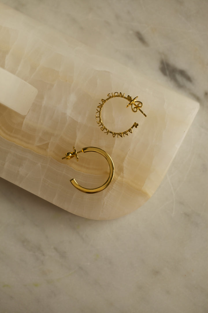 CHAPTER 1 TEXT HOOP EARRINGS - IN SILVER